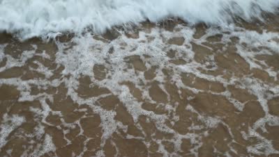 stock-footage-soft-wave-of-the-sea-on-the-sandy-beach